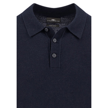 Load image into Gallery viewer, Navy polo shirt with brand label on a white background