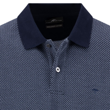 Load image into Gallery viewer, Close-up of a navy blue patterned polo shirt with a brand label.