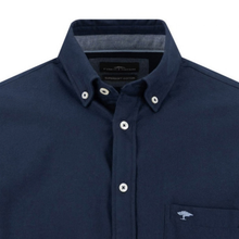 Load image into Gallery viewer, Close-up of a navy blue button-down shirt with white buttons, a pointed collar, and a small embroidered tree logo on the chest pocket.