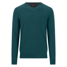 Load image into Gallery viewer, A dark teal green v-neck knit sweater with a small embroidered bird logo on the left chest, displayed on a clean white background.