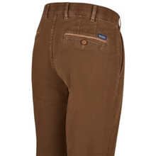Load image into Gallery viewer, Brown pants with a visible brand logo on a white background