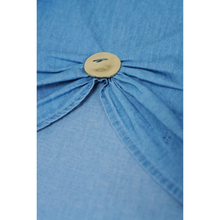 Load image into Gallery viewer, Denim fabric with the zoomed in button.
