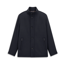 Load image into Gallery viewer, A dark navy blue jacket with a stand-up collar, front button closure, and zippered side pockets, displayed on a clean white background.