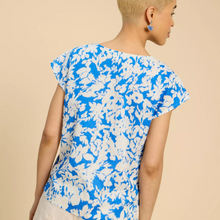 Load image into Gallery viewer, female model standing wearing whitestuff top in blue colour with arms down by side
