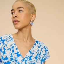 Load image into Gallery viewer, female model looking away from camera wearing whitestuff top in blue colour