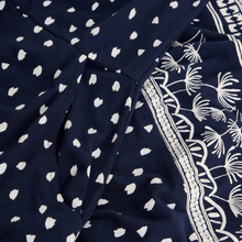 Load image into Gallery viewer, Navy blue fabric with white heart patterns and decorative white border