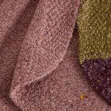 Load image into Gallery viewer, Close-up of a textured, chunky knit fabric with a heathered dusty rose color and flecks of multicolor yarn, folded over to show its pile and texture.