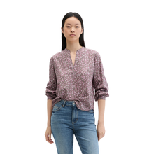 Load image into Gallery viewer, Woman wearing a patterned blouse and jeans on a white background