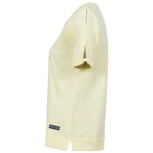 Load image into Gallery viewer, Light yellow off-shoulder top with a brand label on a white background
