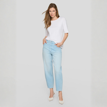 Load image into Gallery viewer, Woman wearing light blue jeans and a white top on a plain background