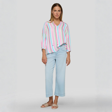 Load image into Gallery viewer, Woman wearing a striped shirt and light blue jeans on a white background
