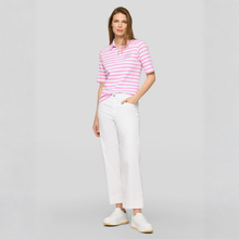 Load image into Gallery viewer, Woman wearing a pink and white striped polo shirt with white pants on a gray background