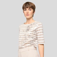 Load image into Gallery viewer, Woman wearing a striped shirt against a plain background