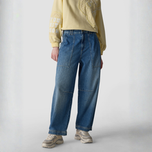 Load image into Gallery viewer, Person wearing a yellow long-sleeve shirt and blue jeans on a white background
