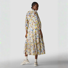 Load image into Gallery viewer, Woman wearing a floral dress on a plain background