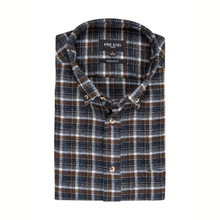 Load image into Gallery viewer, A folded long-sleeve plaid button-down shirt by Prend'Leànd, featuring a dark brown, navy blue, and white checkered pattern with light brown buttons.