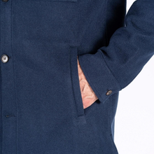 Load image into Gallery viewer, Close up image of dark petrol blue overshirt cuff showing brown button.
