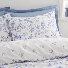 Load image into Gallery viewer, Floral and butterfly patterned bedding set on a bed with pillows.
