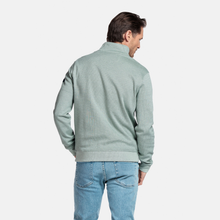 Load image into Gallery viewer, Man wearing a light green sweater and blue jeans on a white background