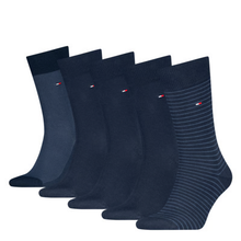 Load image into Gallery viewer, Five pairs of navy blue dress socks arranged in a fan shape on a plain white background. The front pair has thin horizontal stripes, while the others are solid or subtly textured.