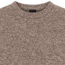 Load image into Gallery viewer, Close-up of a crewneck knit sweater in a heathered brown and beige marled yarn, showing the ribbed collar and a small black neck label.