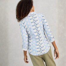 Load image into Gallery viewer, Person wearing a light blue patterned shirt with white sleeves against a gray background