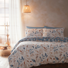 Load image into Gallery viewer, Bed with floral patterned bedding in a bright bedroom