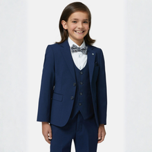 Load image into Gallery viewer, Child wearing a navy blue suit with a white shirt and patterned bow tie on a white background