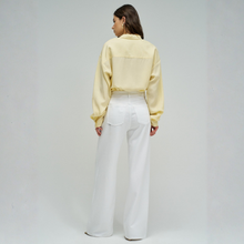 Load image into Gallery viewer, Person wearing a light yellow shirt and white pants on a plain background