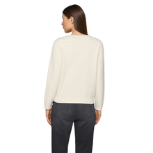 Load image into Gallery viewer, Person wearing a cream sweater and dark jeans on a white background