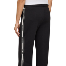 Load image into Gallery viewer, Black pants with white striped side panels on a white background
