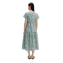 Load image into Gallery viewer, Woman wearing a green floral dress on a white background