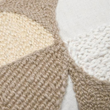 Load image into Gallery viewer, Close-up of a chunky knit textile with geometric color-blocked sections in beige, cream, and white, showing the woven texture in detail.