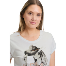 Load image into Gallery viewer, Woman wearing a white t-shirt with a graphic design on a white background