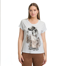 Load image into Gallery viewer, Woman wearing a white t-shirt with a graphic design on a white background