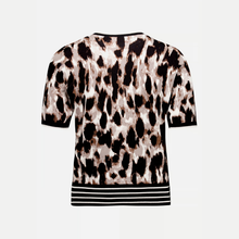 Load image into Gallery viewer, A short-sleeve knit top with an abstract leopard-style print in black, brown, and beige, featuring a black and white striped hem, shown against a light gray background.