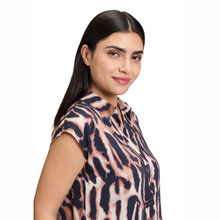 Load image into Gallery viewer, Woman wearing a patterned blouse on a white background