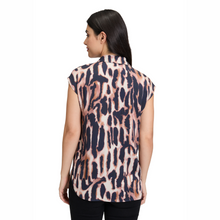 Load image into Gallery viewer, Woman wearing a sleeveless animal print top on a white background