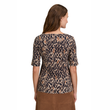 Load image into Gallery viewer, Woman wearing a leopard print top on a white background