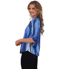 Load image into Gallery viewer, Woman wearing a blue sequin top on a white background