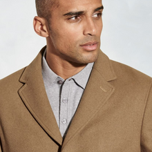 Load image into Gallery viewer, Man wearing a brown coat over a gray shirt against a plain background