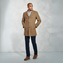 Load image into Gallery viewer, Man wearing a brown coat standing against a plain background