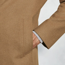 Load image into Gallery viewer, Close-up of a brown coat with a pocket on a white background