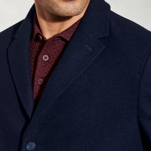 Load image into Gallery viewer, Navy blazer over a red shirt on a plain background