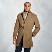 Load image into Gallery viewer, Man wearing a brown coat against a light gray background