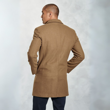 Load image into Gallery viewer, Man wearing a brown coat against a light gray background