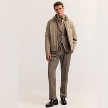 Load image into Gallery viewer, Model with beige jacket over suit on white background