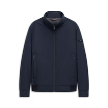 Load image into Gallery viewer, A dark navy blue zip-up jacket with a stand-up collar, zippered hand pockets, and a small black brand patch on the left sleeve, displayed against a solid white background.