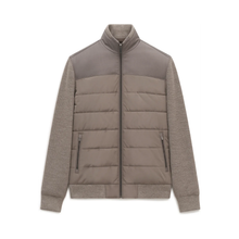 Load image into Gallery viewer, A taupe color-blocked jacket with a quilted puffer body, a smooth upper yoke, and heathered knit sleeves, shown flat on a white background.