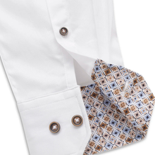 Load image into Gallery viewer, Close-up of a white dress shirt cuff with two brown buttons and a patterned inner lining in beige, brown, and blue.